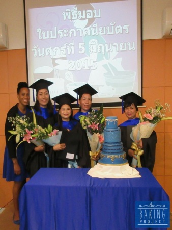Graduated bakery team and finished cake.